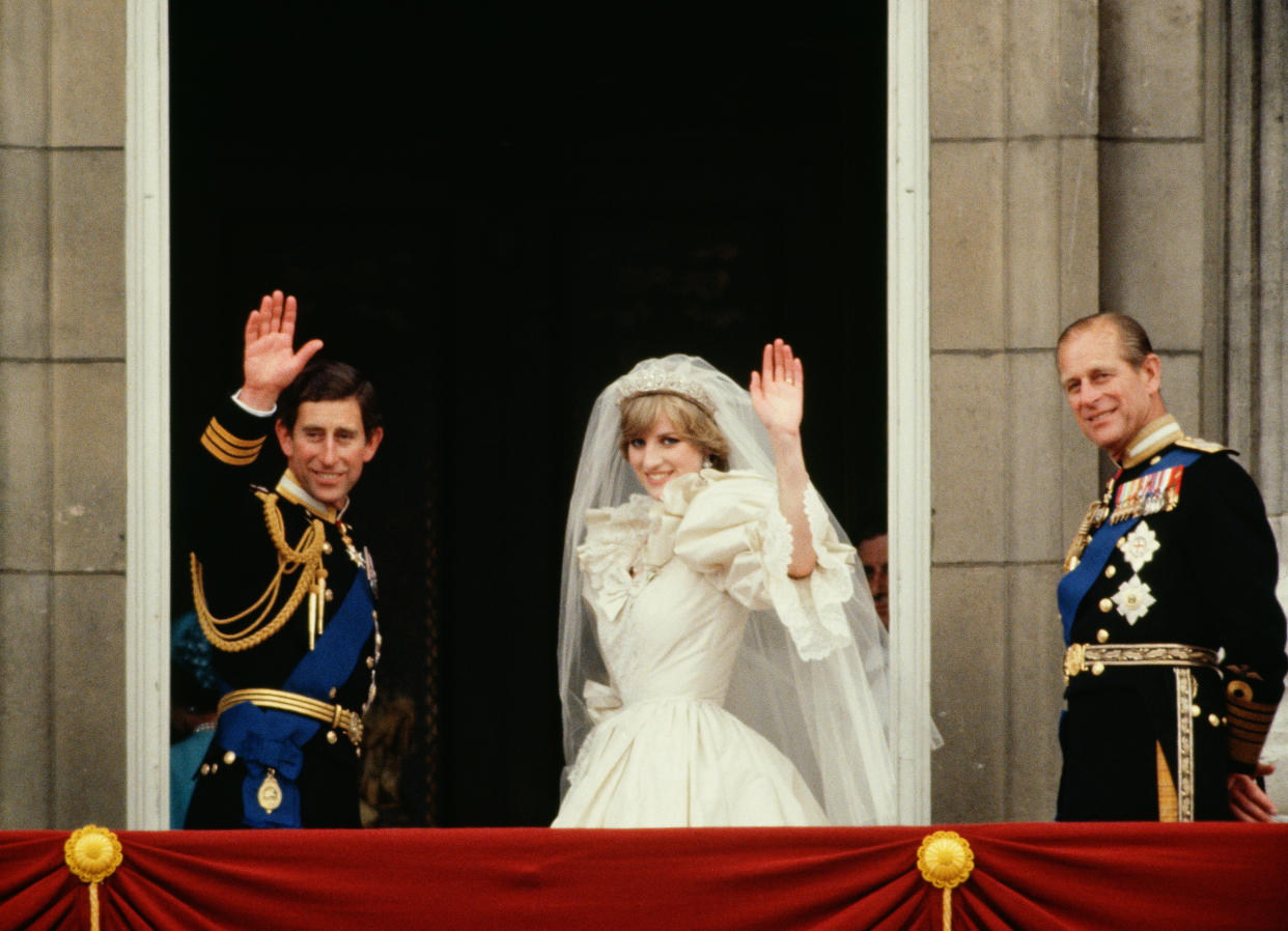 LONDON, UNITED KINGDOM - JULY 29:  Prince Charles And Princess Diana Waving From  The Balcony Of Buckingham Palace.  They Are Accompanied By Prince Philip.  The Princess Is Wearing A Dress Designed By David And Elizabeth Emanuel.  (Photo by Tim Graham Photo Library via Getty Images)