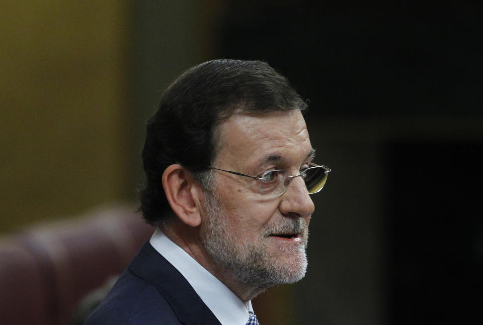 Spain's Prime Minister Mariano Rajoy speaks during a control session at the Spanish Parliament, in Madrid, Spain, Wednesday, July 11, 2012. Spain has announced a euro 65 billion austerity package that includes tax hikes and spending cuts a day after winning approval from euro zone partners for a huge bailout of Spain’s banks. (AP Photo/Andres Kudacki)