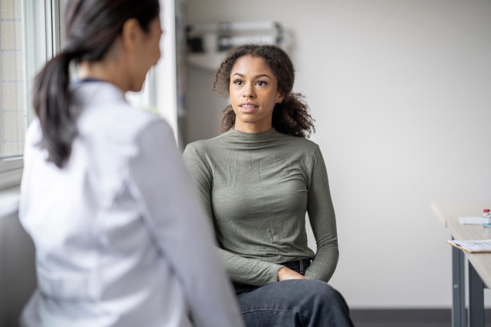 A doctor speaking with a patient