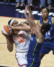 Connecticut Sun center Brionna Jones (42) runs into the defense of Minnesota Lynx forward Bridget Carleton (6) during a WNBA basketball game Sunday, Aug. 14, 2022, in Uncasville, Conn. (Sean D. Elliot/The Day via AP)