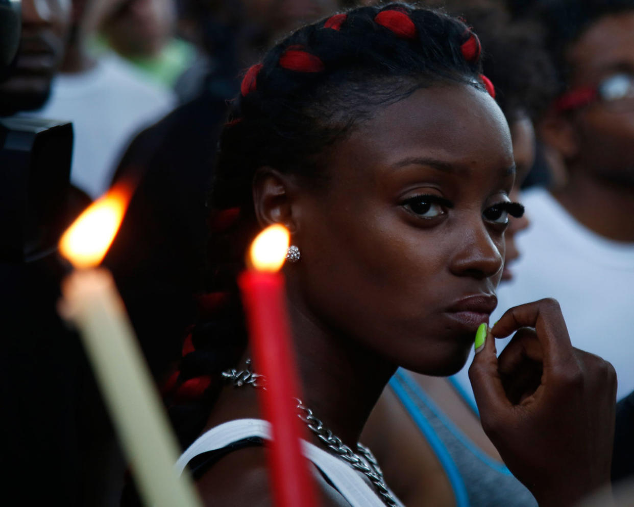 People gather on Aug. 14 at the place where Milwaukee police shot and killed Sylville Smith. (Photo: Jeffrey Phelps/AP)