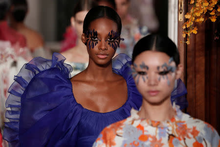 Models present creations by Italian designer Pier Paolo Piccioli as part of his Haute Couture Spring-Summer 2019 collection show for fashion house Valentino in Paris, France, January 23, 2019. REUTERS/Benoit Tessier