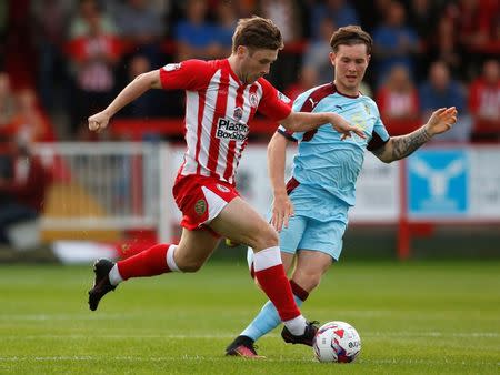 Football Soccer Britain - Accrington Stanley v Burnley - EFL Cup Second Round - Wham Stadium - 24/8/16 Accrington Stanley's Shay McCartan in action with Burnley's Aiden O'Neill Action Images via Reuters / Ed Sykes