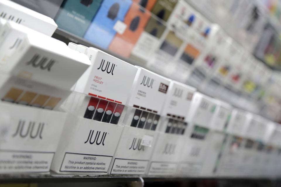 Juul products are displayed at a smoke shop in New York. The popular e-cigarette company has faced a number of lawsuits over its products and its use by children. (Photo: ASSOCIATED PRESS)