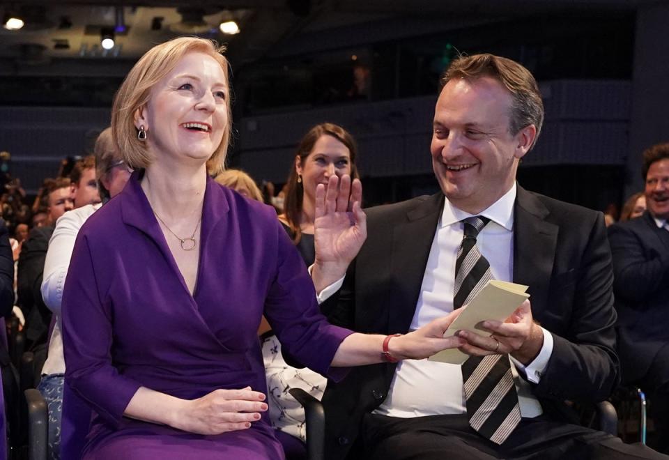 Liz Truss with her husband Hugh O’Leary, at the Queen Elizabeth II Centre in London as it was announced that she is the new Conservative party leader (PA)