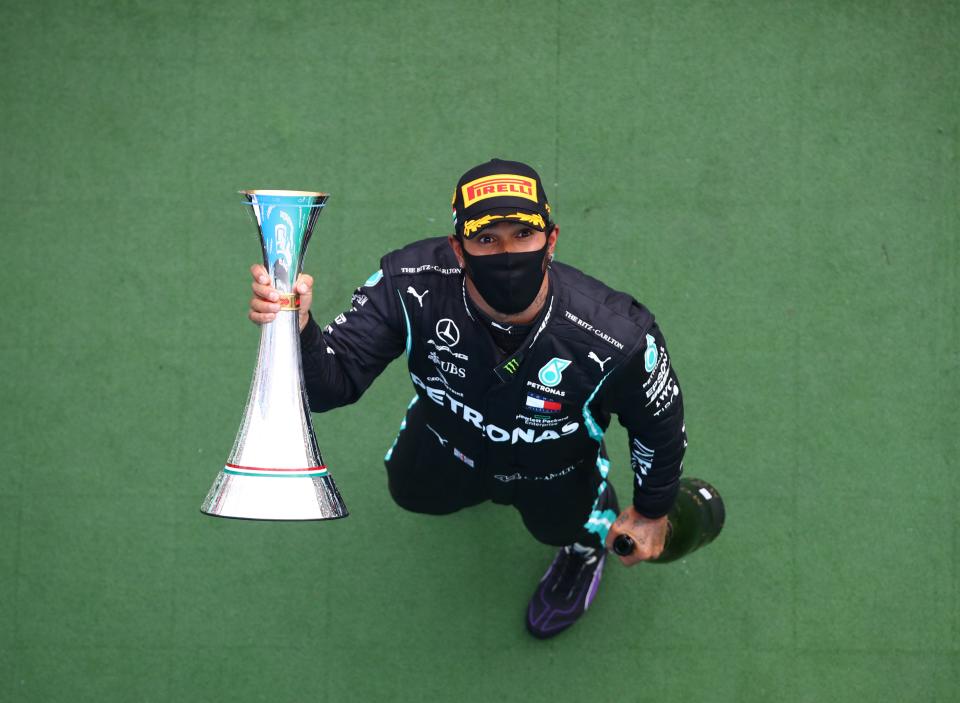 Mercedes' British driver Lewis Hamilton celebrates with the trophy after winning the Formula One Hungarian Grand Prix race at the Hungaroring circuit in Mogyorod near Budapest, Hungary, on July 19, 2020. (Photo by Mark Thompson / POOL / AFP) (Photo by MARK THOMPSON/POOL/AFP via Getty Images)
