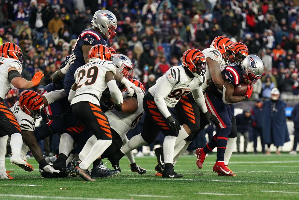 New England Patriots running back Rhamondre Stevenson (38) runs the ball against the Cincinnati Bengals in a game on Dec. 24.