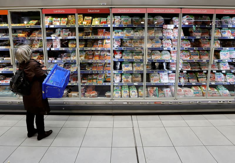 FILE PHOTO: A customer shops in a supermarket in Nice