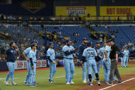 Toronto Blue Jays players and coach stand on the field after Blue Jays pitcher Ryan Borucki hit Tampa Bay Rays' Kevin Kiermaier with a pitch during the eighth inning of a baseball game Wednesday, Sept. 22, 2021, in St. Petersburg, Fla. (AP Photo/Chris O'Meara)