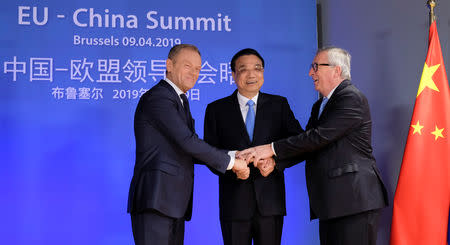 Chinese Premier Li Keqiang is welcomed by European Council President Donald Tusk and European Commission President Jean-Claude Juncker ahead of a EU China Summit in Brussels, Belgium, April 9, 2019. Olivier Hoslet/Pool via REUTERS