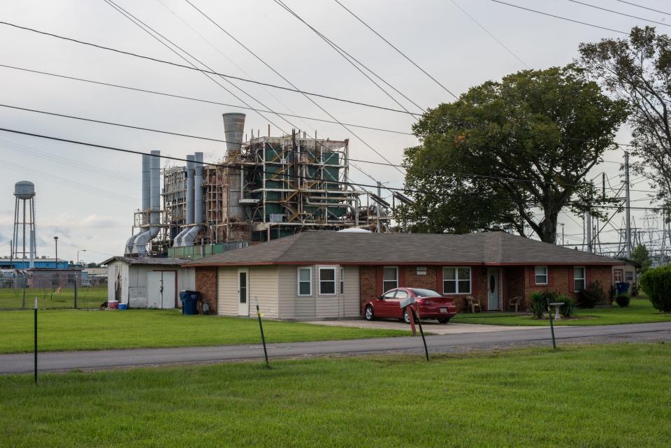 A house sits along the long stretch of River Road by the Mississippi River and the many chemical plants October 12, 2013.