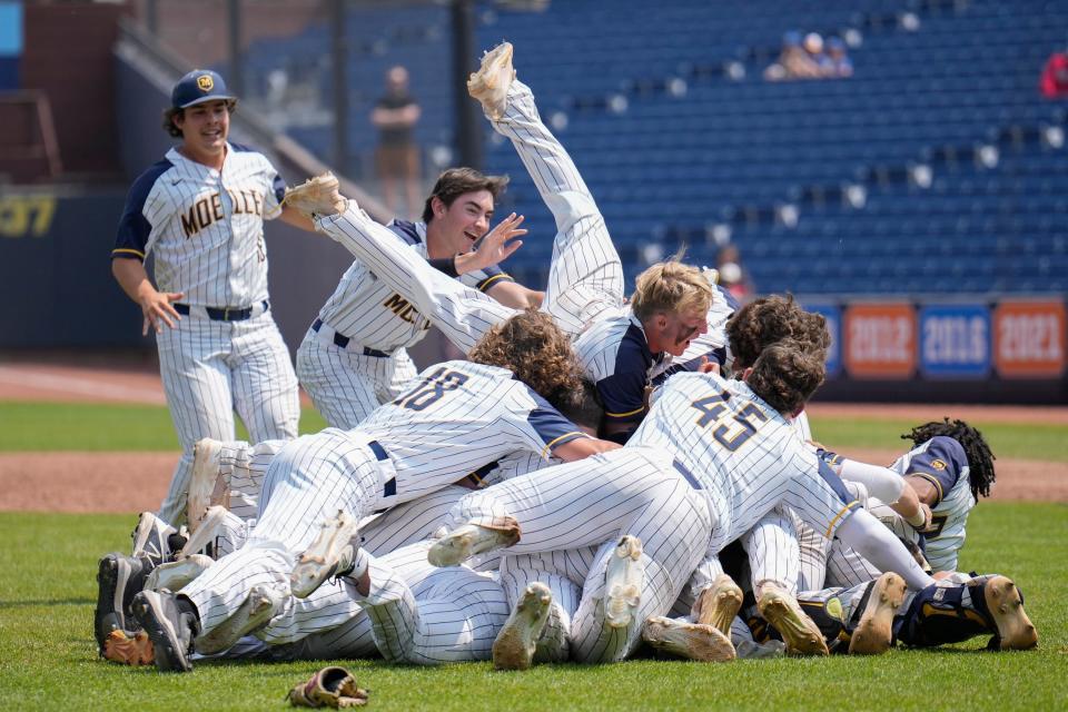 The Crusaders celebrate their 4-1 win over Olentangy Orange in the Division I state final baseball game at Canal Park.