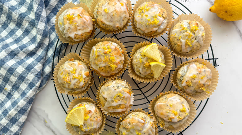 iced lemon poppy seed muffins on wire rack