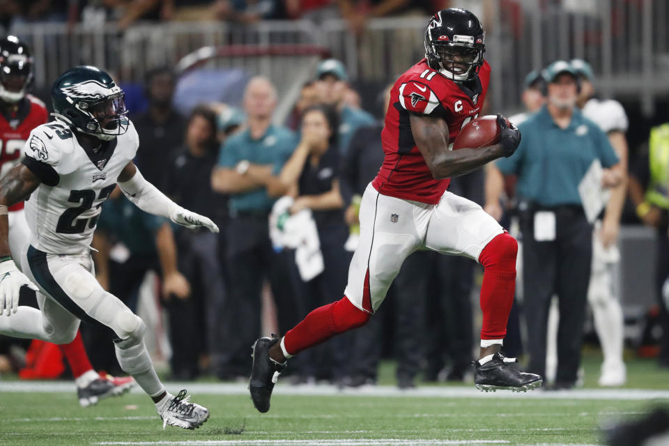 FILE - Atlanta Falcons wide receiver Julio Jones (11) runs toward the end zone for a touchdown against Philadelphia Eagles free safety Rodney McLeod (23) during the second half of an NFL football game in Atlanta, in this Sunday, Sept. 15, 2019, file photo. The Tennessee Titans have traded with the Atlanta Falcons for seven-time Pro Bowl wide receiver Julio Jones, a person familiar with the situation told The Associated Press. (AP Photo/John Bazemore, File)