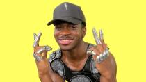 <p>For his lyric-explaining interview with Genius, Lil Nas X looked pretty chill from the neck up. It's the finger armor and structured top that give the look his own personal touch.</p>