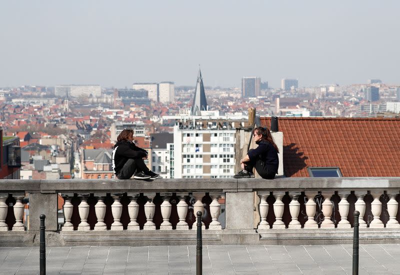 People practice social distancing at a viewpoint in central Brussels