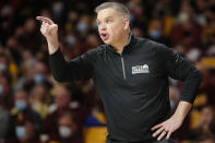 Ohio State head coach Chris Holtmann yells to his team as they play against Minnesota in the first half of an NCAA college basketball game Thursday, Jan. 27, 2022, in Minneapolis. (AP Photo/Bruce Kluckhohn)