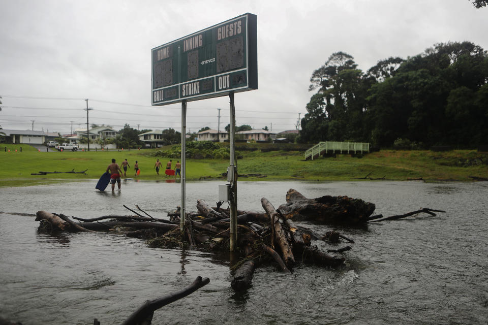 Floodwaters surround a baseball scoreboard during flooding from Tropical Storm Lane on the Big Island, in Hilo, Hawaii.&nbsp; (Photo: Mario Tama via Getty Images)