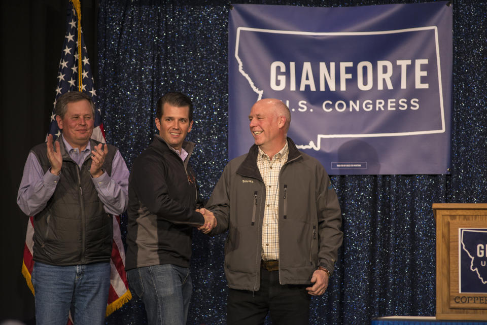 President Donald Trump's eldest child, Donald Trump Jr., center, campaigns in April for Republican Greg Gianforte, right. Gianforte capitalized on the president's popularity in Montana. (Photo: William Campbell/Getty Images)