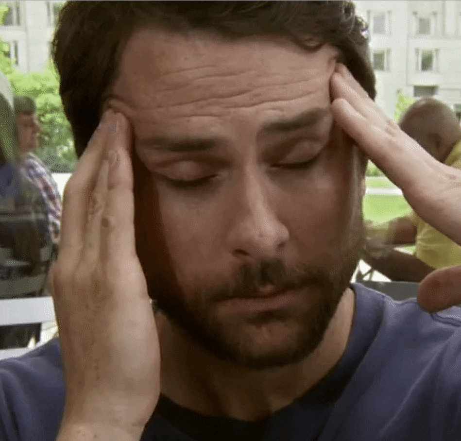 distraught Charlie Day rubbing his head in frustration