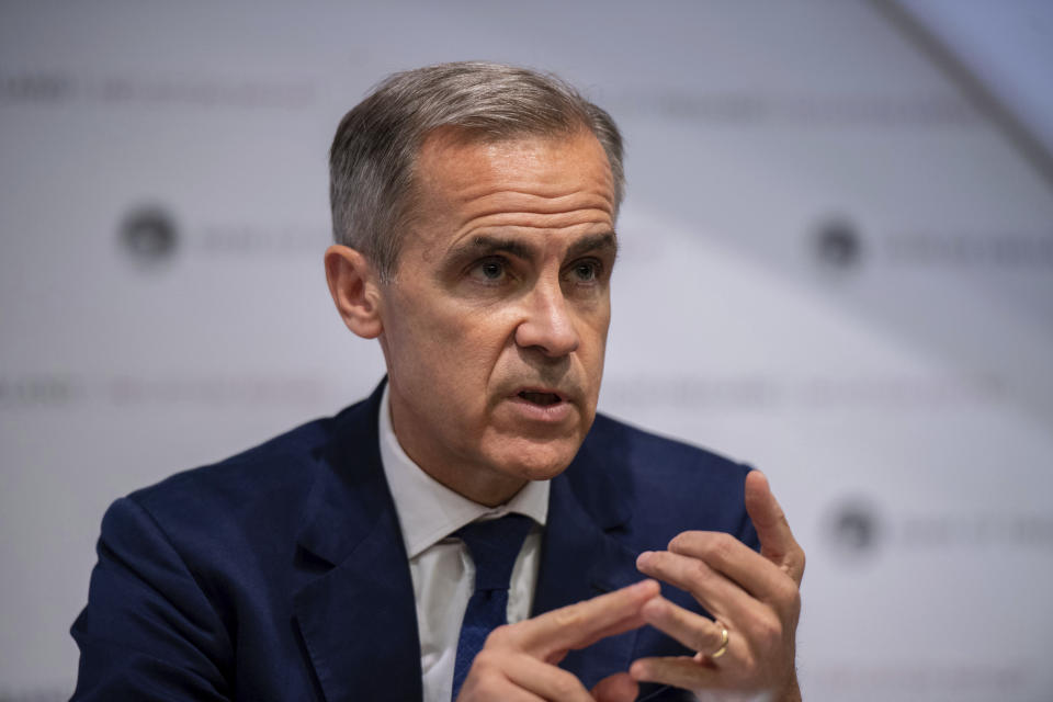 Governor of the Bank of England, Mark Carney speaks during the Bank of England interest rate decision and inflation report press conference at the Bank of England in London,  Thursday, Aug. 1, 2019. Brexit uncertainties are becoming "more entrenched" and increasingly weighing on the British economy less than three months before the country is scheduled to leave the European Union, the Bank of England said Thursday.(Chris J Ratcliffe/Pool Photo via AP)