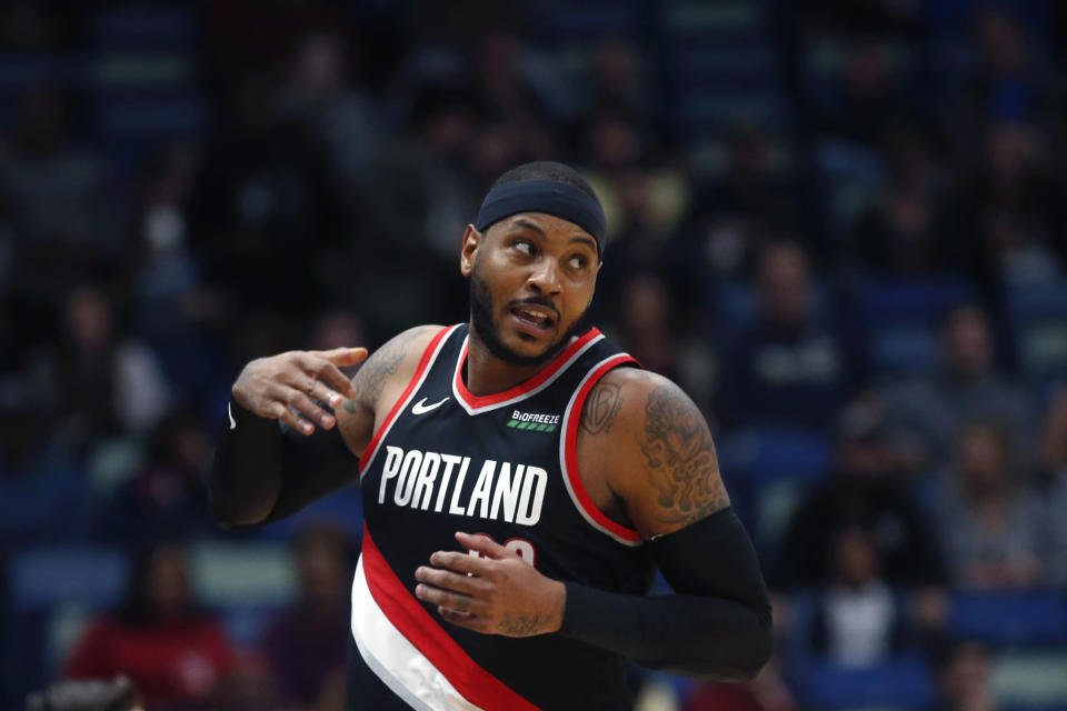 Portland Trail Blazers forward Carmelo Anthony turns down court after making a 3-point basket in the first half of an NBA basketball game against the New Orleans Pelicans in New Orleans, Tuesday, Nov. 19, 2019. (AP Photo/Gerald Herbert)