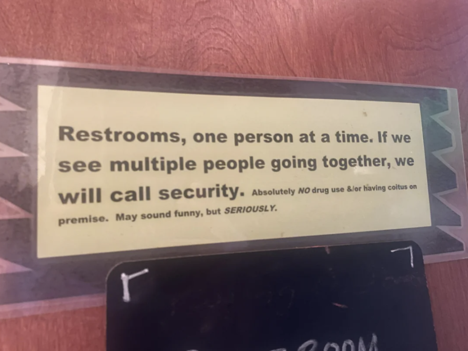 Sign stating restrooms are for one person at a time and multiple entries will lead to security being called, with emphasis on prohibition of drug use