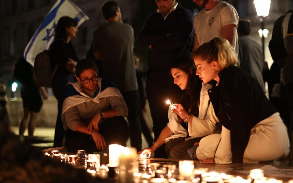 People take part in a 'Vigil for Israel' opposite the entrance to Downing Street