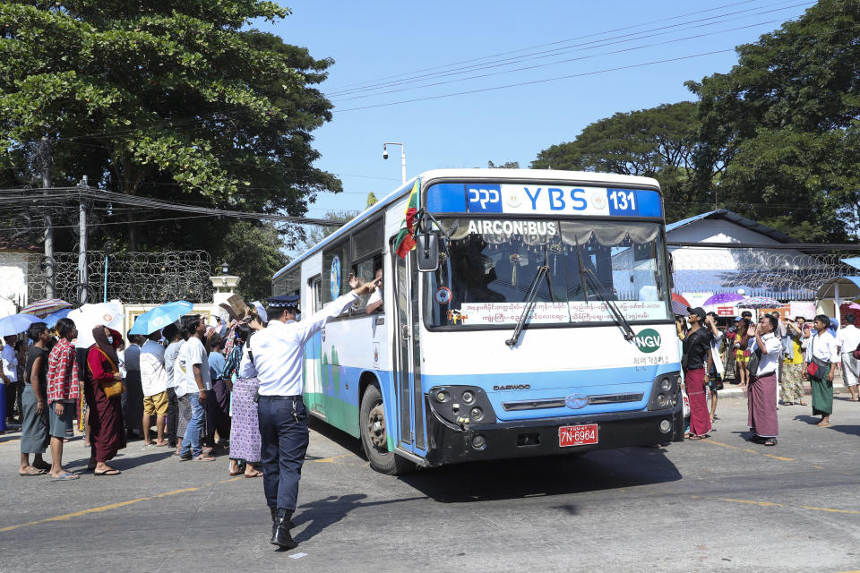 A bus carrying released prisoners is welcomed by family members and colleagues as it leaves Insein Prison in Yangon, Myanmar, Thursday, Jan. 4, 2024. Myanmar’s military government on Thursday pardoned nearly 10,000 prisoners to mark the 76th anniversary of gaining independence from Britain, but it wasn’t immediately clear if any of those released included the thousands of political detainees jailed for opposing army rule.(AP Photo/Thein Zaw)