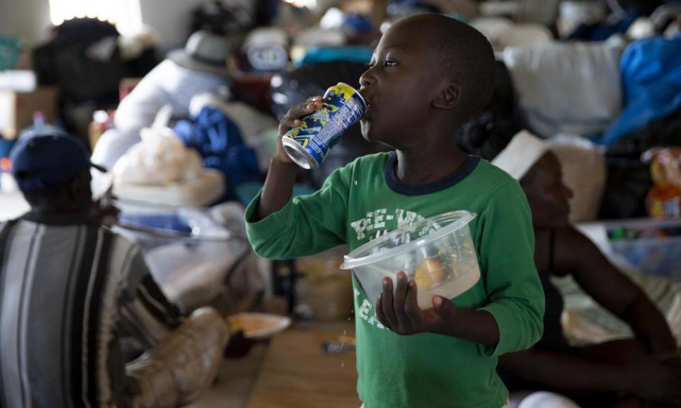 A boy eats at the Full Gospel church in Sand Banks, on 9 September 2019 in Great Abaco, Bahamas.