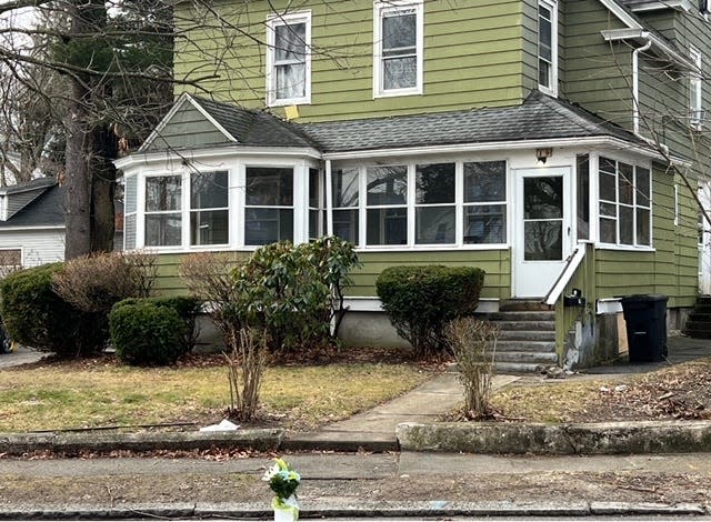 A flower arrangement was placed at a spot on Englewood Avenue where a shooting was investigated Tuesday.