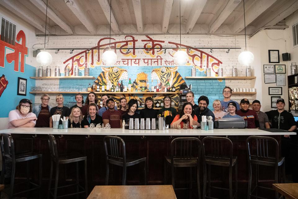 Meherwan and Molly Irani with some of their staff at Chai Pani in downtown Asheville March 17, 2022.