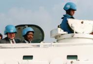 FILE - In this file photo dated Tuesday Aug. 12, 1997, the UN Secretary General Kofi Annan, centre, inspects the Swedish army base SWEDINT, south of Stockholm, with Swedish defense minister, Bjoern von Sydow, left. The SWEDINT is a training camp for Swedish UN soldiers. Kofi Annan, one of the world's most celebrated diplomats and a charismatic symbol of the United Nations who rose through its ranks to become the first black African secretary-general, has died aged 80, according to an announcement by his foundation Saturday Aug. 18, 2018. (Evan P Schneider/UN via AP, FILE)