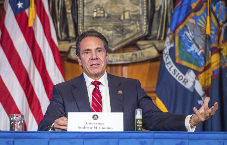 In this Wednesday, Nov. 18, 2020 photo provided by the Office of Governor Andrew M. Cuomo, Gov. Cuomo holds a press briefing on the coronavirus in the Red Room at the State Capitol in Albany, N.Y. During the news conference, Cuomo predicted a "tremendous spike" in COVID-19 cases after Thanksgiving as he pleaded with people not to be lulled into a false sense of safety over the holiday. (Darren McGee/Office of Governor Andrew M. Cuomo via AP)