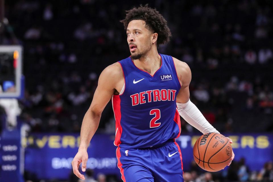 Pistons guard Cade Cunningham looks to pass against the Grizzlies during the second half of the Pistons' 116-102 loss on Wednesday, Dec. 6, 2023, at Little Caesars Arena.