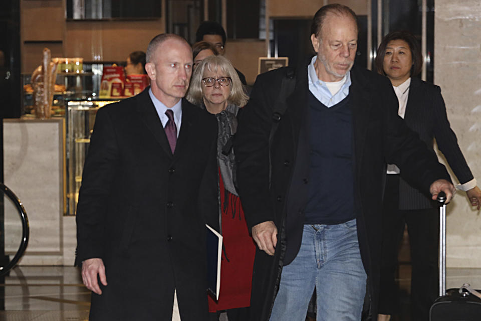 Members of a U.S. trade delegation including deputy U.S. trade representative, Jeffrey D. Gerrish, left, arrive at a hotel in Beijing, China, Sunday, Jan. 6, 2019. The U.S. delegation led by Gerrish arrived in the Chinese capital ahead of trade talks with China,(AP Photo/Ng Han Guan)