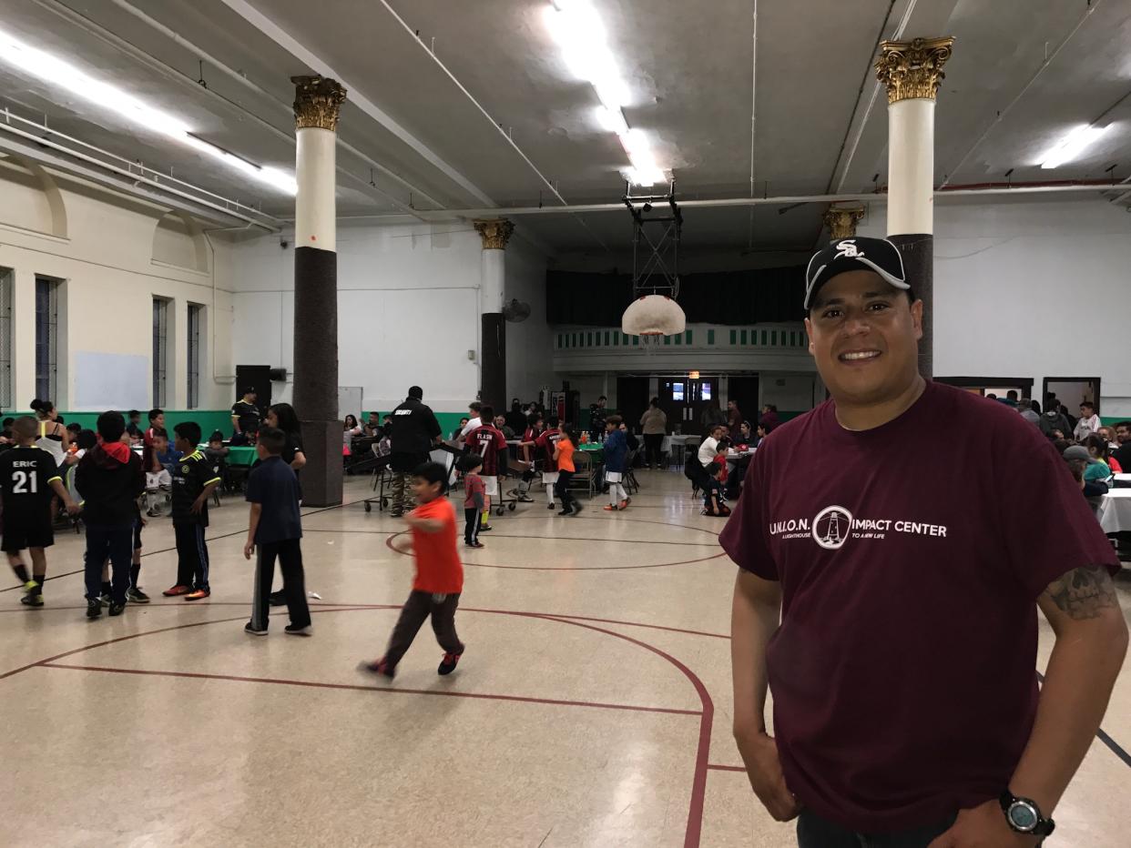 Ramiro Alvarez, a Chicago police officer and vice president of the Union Impact Center, welcomes kids and their families from Back of the Yards to celebrate the end of the winter soccer season. The center’s soccer program is just one of several community-based programs designed to deter the neighborhood’s youngest residents from getting sucked into the cycle of gang violence. (Photo: Caitlin Dickson/Yahoo News)