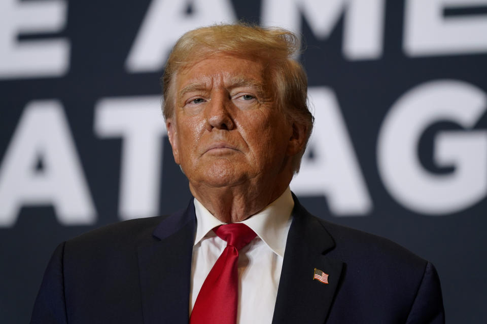 FILE - Former President Donald Trump arrives at a rally in Cedar Rapids, Iowa, Saturday, Oct. 7, 2023. A lawyer for Donald Trump told a London judge Monday, Oct. 16, 2023, that the ex-president plans to prove that a discredited report by a former British spy that contained “shocking and scandalous claims” that he was compromised by Russians in his first bid for the presidency was wrong and harmed his reputation. (AP Photo/Charlie Neibergall, File)