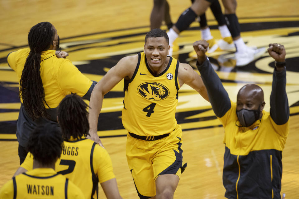 Missouri's Javon Pickett celebrates with teammates after Missouri defeated Illinois 81-78 in an NCAA college basketball game Saturday, Dec. 12, 2020, in Columbia, Mo. (AP Photo/L.G. Patterson)