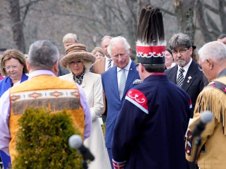 Lt.-Gov. Judy Foote stands next to the Duchess of Cornwall and the Prince of Wales during a ceremony in the Heart Garden at Government House. (Paul Chiasson/The Canadian Press - image credit)