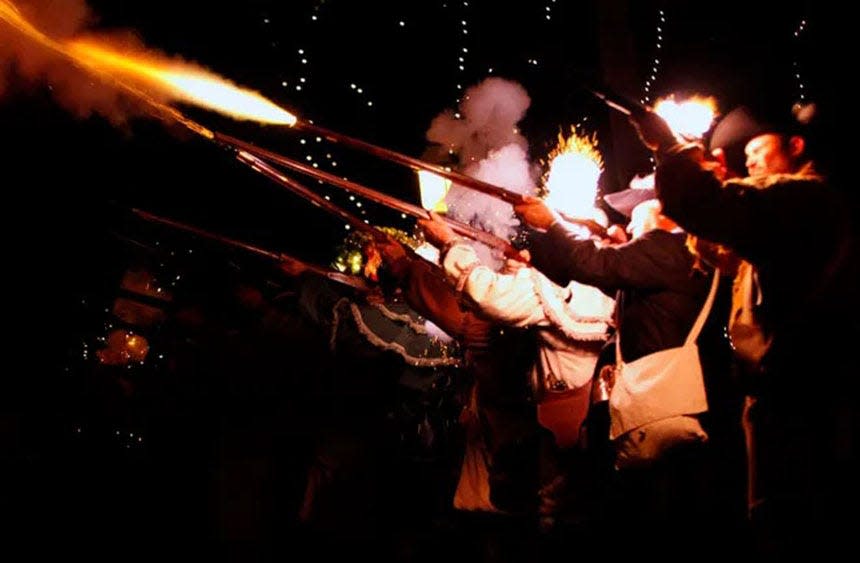 Re-enactors portray British Soldiers during the Grande Illumination at the 39th British Night Watch on Dec. 7, 2013.