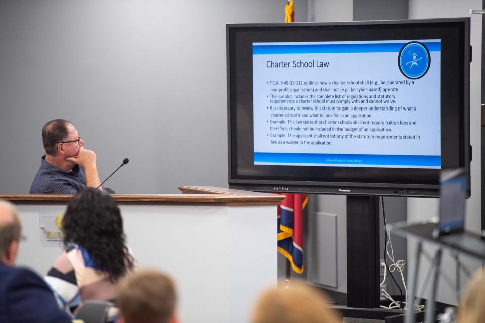 School Board member Harvey Walden looks to the screen as the Charter School Review team presents their findings during a Jackson-Madison County School Board meeting in Jackson, Tennessee, on Tuesday, July 25, 2023.