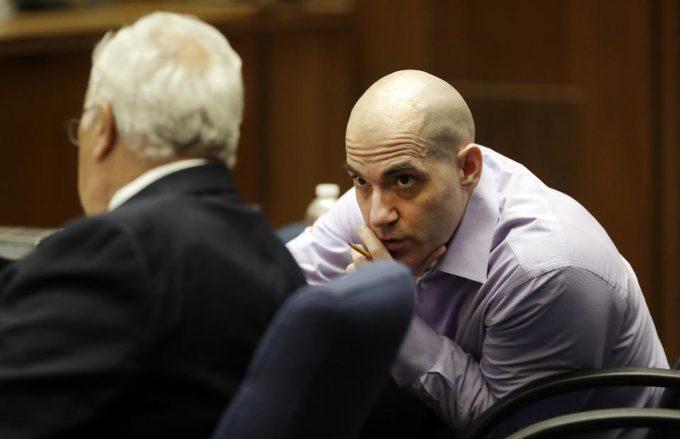 Michael Gargiulo, right, talks to his attorney Dale Rubin during closing arguments in the trial of People vs. Michael Gargiulo Wednesday, Aug. 7, 2019, in Los Angeles. Closing arguments continued Wednesday in the trial of the air conditioning repairman charged with killing two Southern California women and attempting to kill a third. (AP Photo/Marcio Jose Sanchez, Pool)