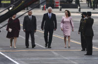 Cuba's first lady Lis Cuesta, from left, Mexico's President Andres Manuel Lopez Obrador, Cuba's President Miguel Diaz-Canel and Mexico's first lady Beatriz Gutierrez Muller, take part in Mexico's Independence Day celebrations, in the Zocalo in Mexico City, Thursday, Sept. 16, 2021. (AP Photo/Marco Ugarte)