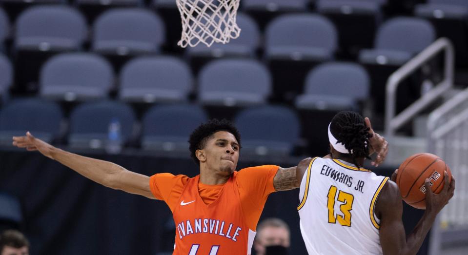 Valparaiso's Sheldon Edwards (13) gets to a rebound ahead of University of EvansvilleÕs Trey Hall (44) during their game at the Ford Center Monday night, Feb. 1, 2021.