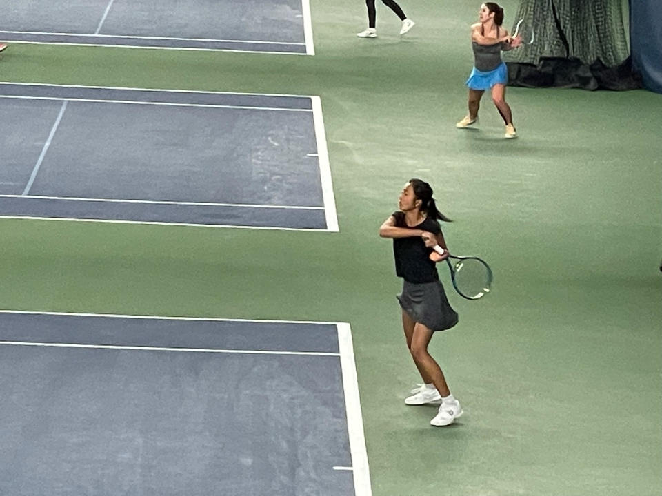 Hoo playing tennis, taken by her mom, May Voo.