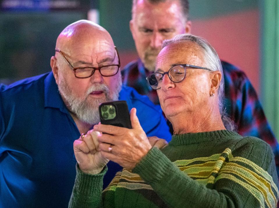 Desert Water Agency Division 3 candidate Jeff Bowman (right) and Mayor Pro Tem Gary Gardner watch election night results come in during an election night watch party at Playoffs sports bar on Tuesday.