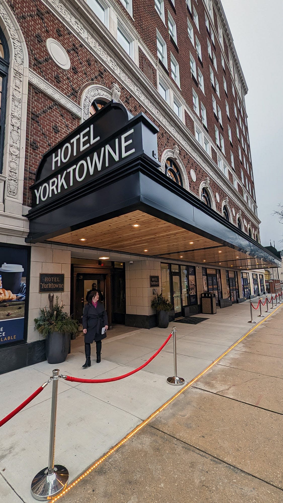 The velvet ropes lead visitors to the old main entrance of the Yorktowne Hotel opening.
