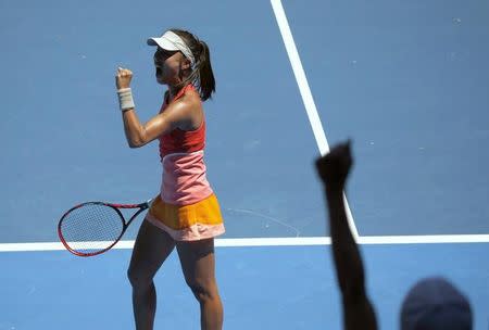 China's Wang Qiang celebrates winning her first round match against Sloane Stephens of the U.S. at the Australian Open tennis tournament at Melbourne Park, Australia, January 18, 2016. REUTERS/Tyrone Siu