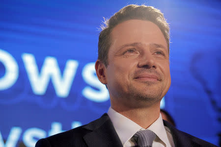 Rafal Trzaskowski, Civic Coalition candidate for mayor of Warsaw, reacts after the exit poll results of the Polish regional elections are announced in Warsaw, Poland October 21, 2018. Agencja Gazeta/Dawid Zuchowski via REUTERS